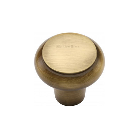 This is an image of a Heritage Brass - Cabinet Knob Round Edge Design 32mm Antique Brass Finish, c3990-32-at that is available to order from T.H Wiggans Ironmongery in Kendal.