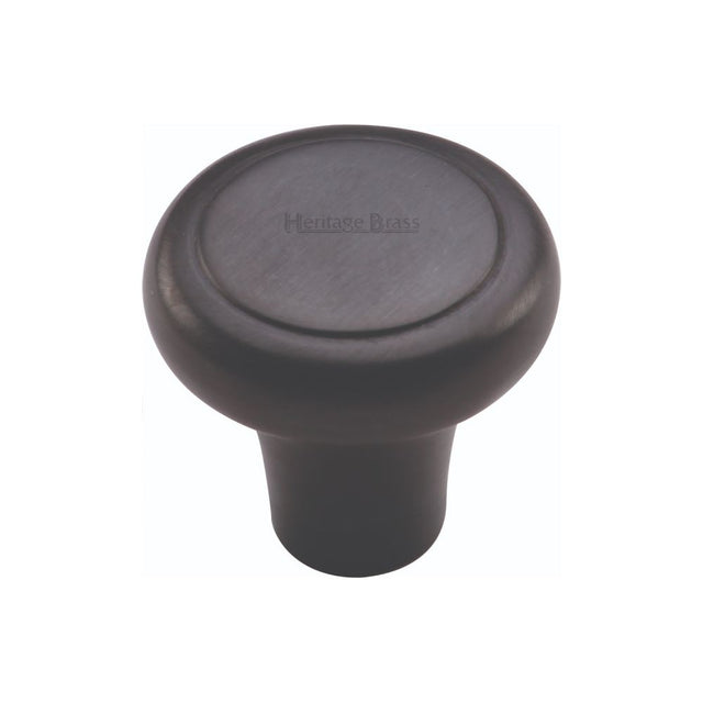 This is an image of a Heritage Brass - Cabinet Knob Round Edge Design 38mm Matt Black Finish, c3990-38-bkmt that is available to order from T.H Wiggans Ironmongery in Kendal.