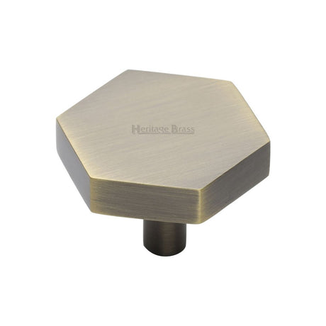 This is an image of a Heritage Brass - Cabinet Knob Hexagon Design 38mm Antique Brass Finish, c4344-38-at that is available to order from T.H Wiggans Ironmongery in Kendal.