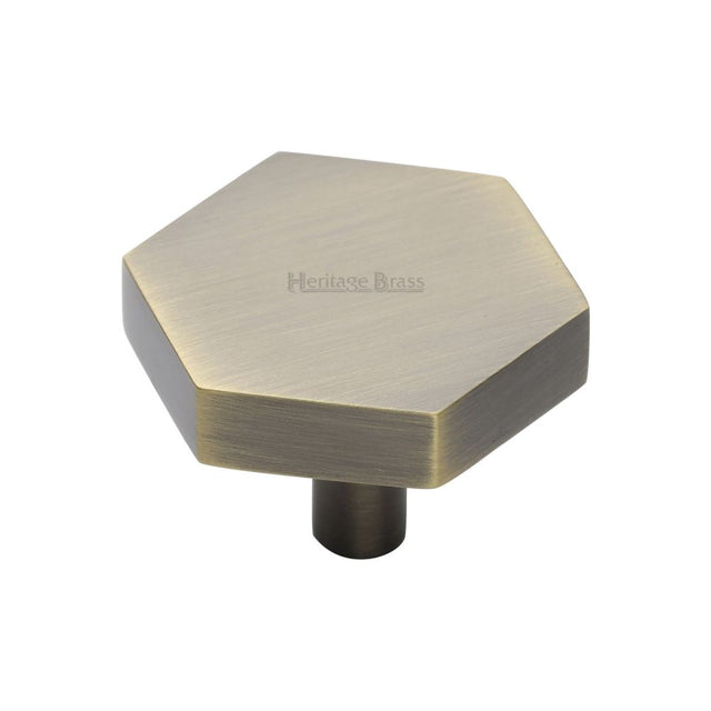 This is an image of a Heritage Brass - Cabinet Knob Hexagon Design 38mm Antique Brass Finish, c4344-38-at that is available to order from T.H Wiggans Ironmongery in Kendal.