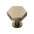 This is an image of a Heritage Brass - Cabinet Knob Hexagon Design with Rose 32mm Antique Brass Finish, c4345-32-at that is available to order from T.H Wiggans Ironmongery in Kendal.
