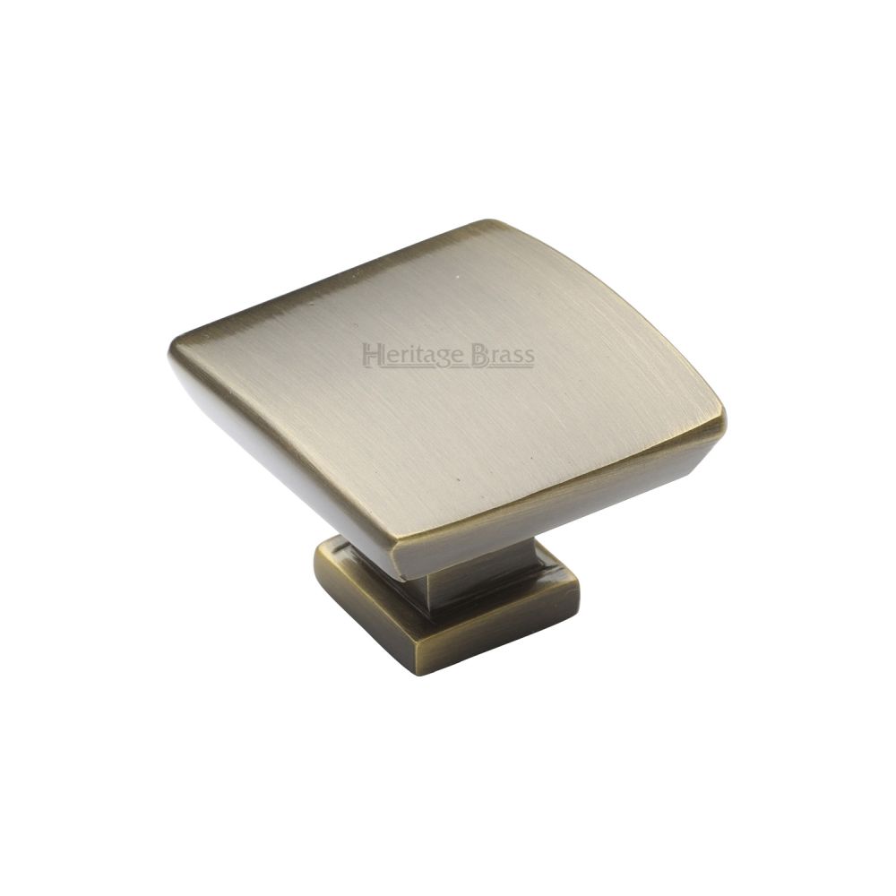 This is an image of a Heritage Brass - Cabinet Knob Plinth Square Design with base 35mm Antique Brass Fin, c4382-35-at that is available to order from T.H Wiggans Ironmongery in Kendal.