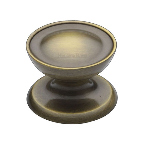 This is an image of a Heritage Brass - Cabinet Knob Surrey Design 38mm Antique Brass Finish, c4386-38-at that is available to order from T.H Wiggans Ironmongery in Kendal.