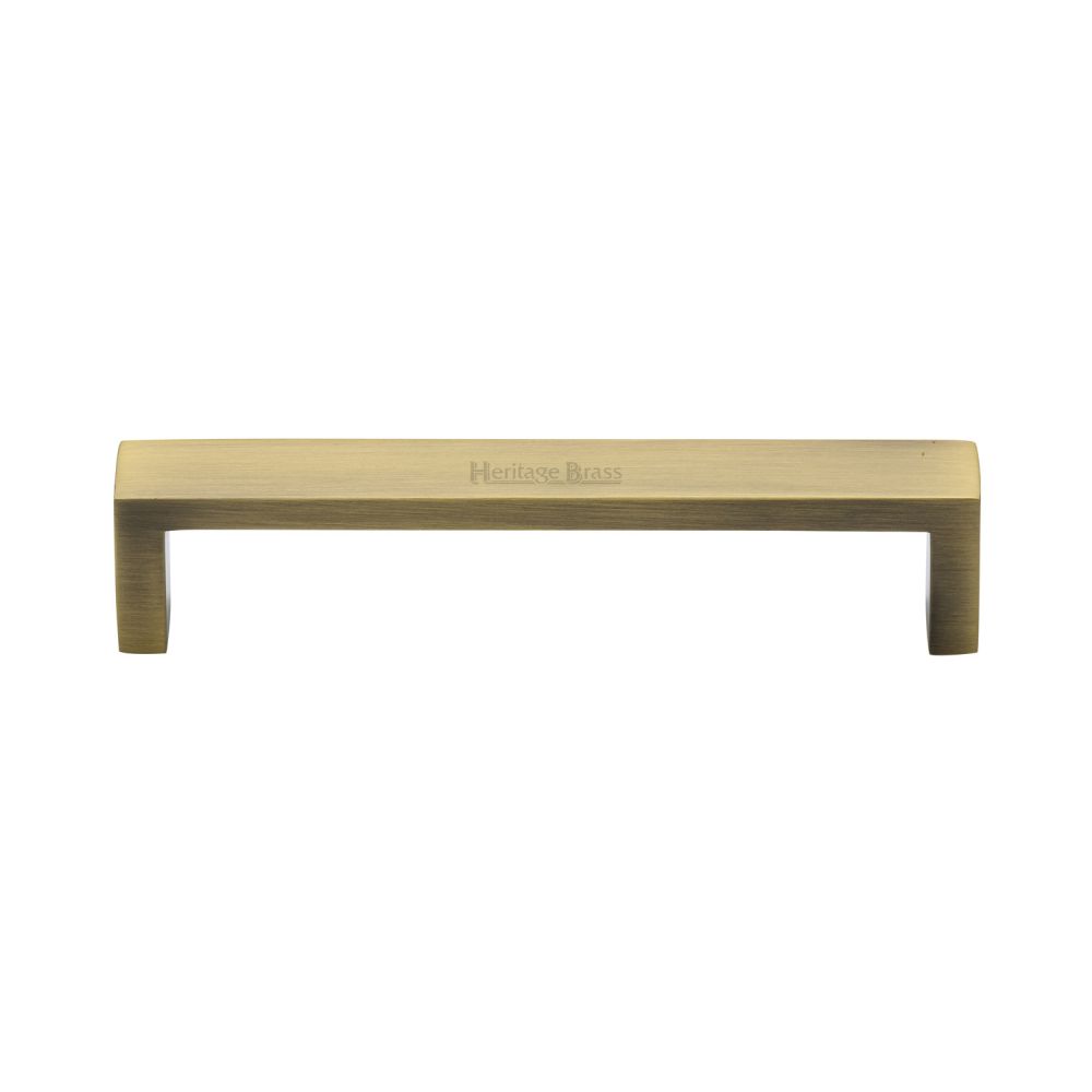 This is an image of a Heritage Brass - Cabinet Pull Wide Metro Design 128mm CTC Antique Brass Finish, c4520-128-at that is available to order from T.H Wiggans Ironmongery in Kendal.