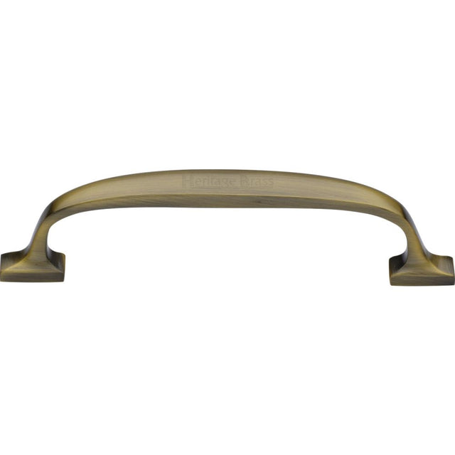 This is an image of a Heritage Brass - Cabinet Pull Durham Design 128mm CTC Antique Brass Finish, c7213-128-at that is available to order from T.H Wiggans Ironmongery in Kendal.