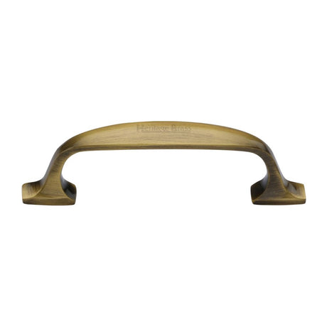 This is an image of a Heritage Brass - Cabinet Pull Durham Design 76mm CTC Antique Brass Finish, c7213-76-at that is available to order from T.H Wiggans Ironmongery in Kendal.