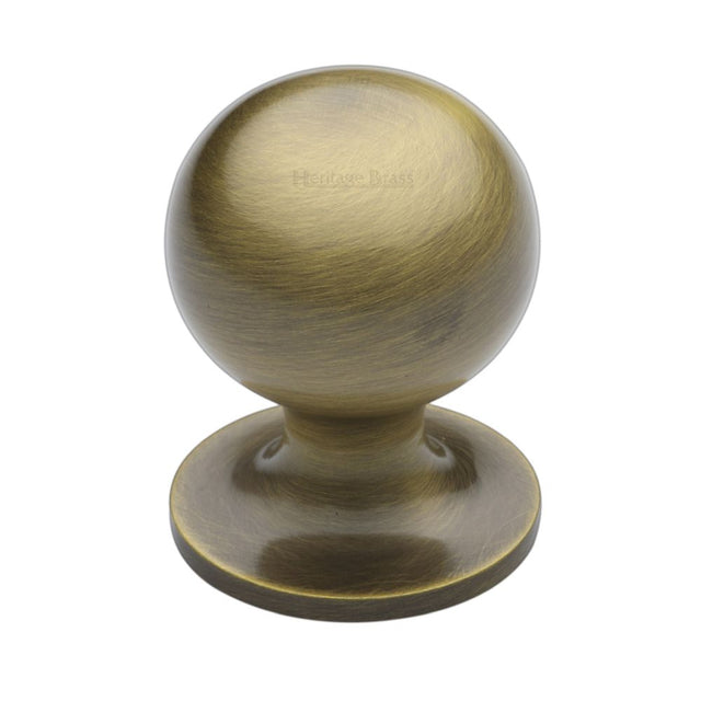 This is an image of a Heritage Brass - Cabinet Knob Ball Design 32mm Antique Brass Finish, c8321-32-at that is available to order from T.H Wiggans Ironmongery in Kendal.