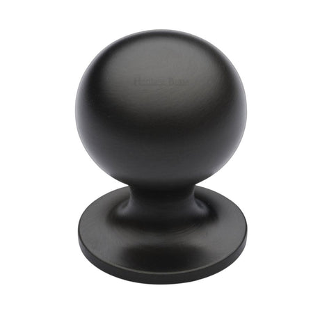 This is an image of a Heritage Brass - Cabinet Knob Ball Design 32mm Matt Bronze Finish, c8321-32-mb that is available to order from T.H Wiggans Ironmongery in Kendal.