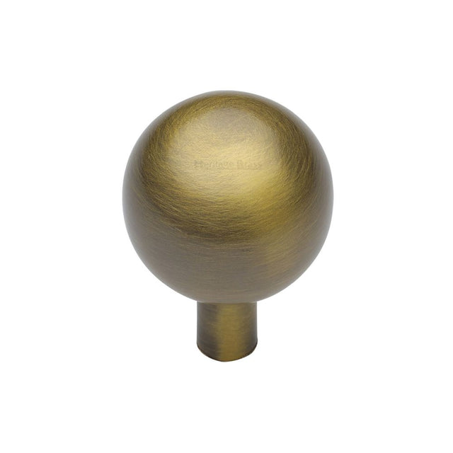 This is an image of a Heritage Brass - Cabinet Knob Sphere Design 22mm Antique Brass Finish, c8323-22-at that is available to order from T.H Wiggans Ironmongery in Kendal.