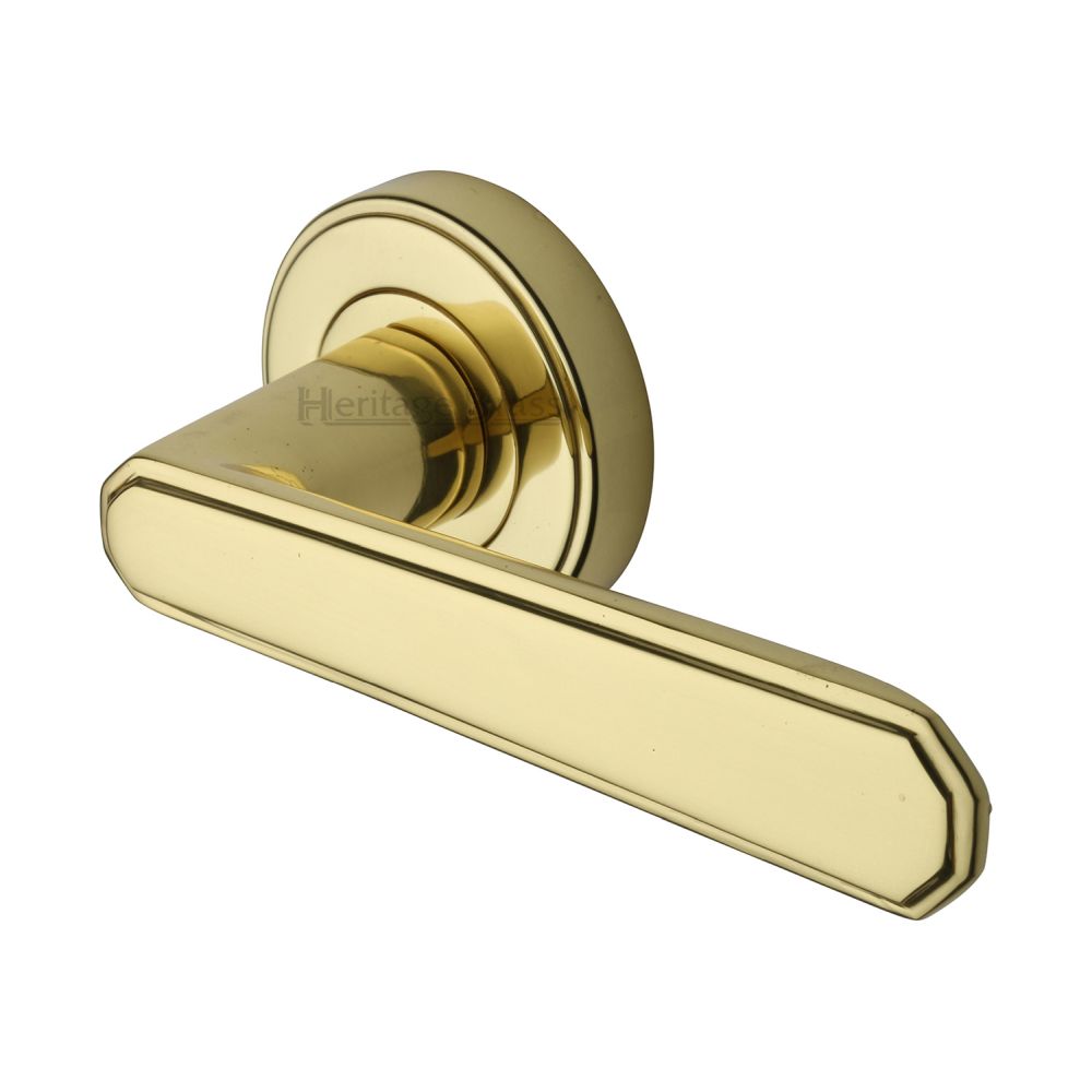 This is an image of a Heritage Brass - Door Handle Lever Latch on Round Rose Century Design Polished Brass, cen1924-pb that is available to order from T.H Wiggans Ironmongery in Kendal.