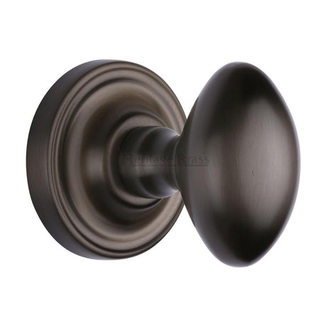 This is an image of a Heritage Brass - Mortice Knob on Rose Chelsea Design Matt Bronze Finish, che7373-mb that is available to order from T.H Wiggans Ironmongery in Kendal.