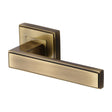 This is an image of a Heritage Brass - Door Handle Lever Latch on Square Rose Linear SQ Design Antique Br, dec5430-at that is available to order from T.H Wiggans Ironmongery in Kendal.
