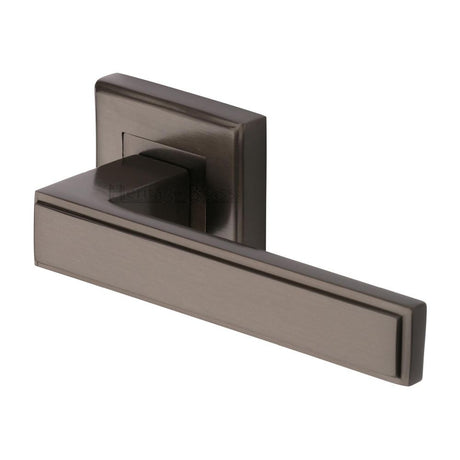 This is an image of a Heritage Brass - Door Handle Lever Latch on Square Rose Linear SQ Design Matt Br, dec5430-mb that is available to order from T.H Wiggans Ironmongery in Kendal.