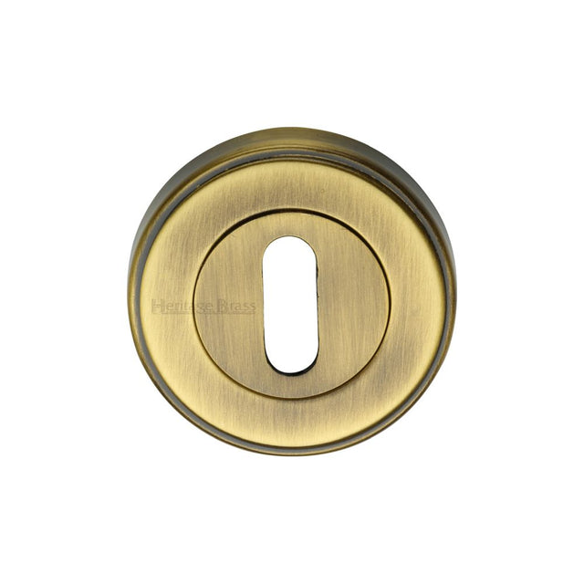 This is an image of a Heritage Brass - Key Escutcheon Antique Brass Finish, erd7000-at that is available to order from T.H Wiggans Ironmongery in Kendal.