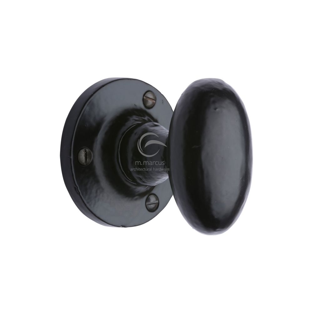 This is an image of a M.Marcus - Black Iron Rustic Mortice Knob on Rose Knowle Design, fb4555 that is available to order from T.H Wiggans Ironmongery in Kendal.