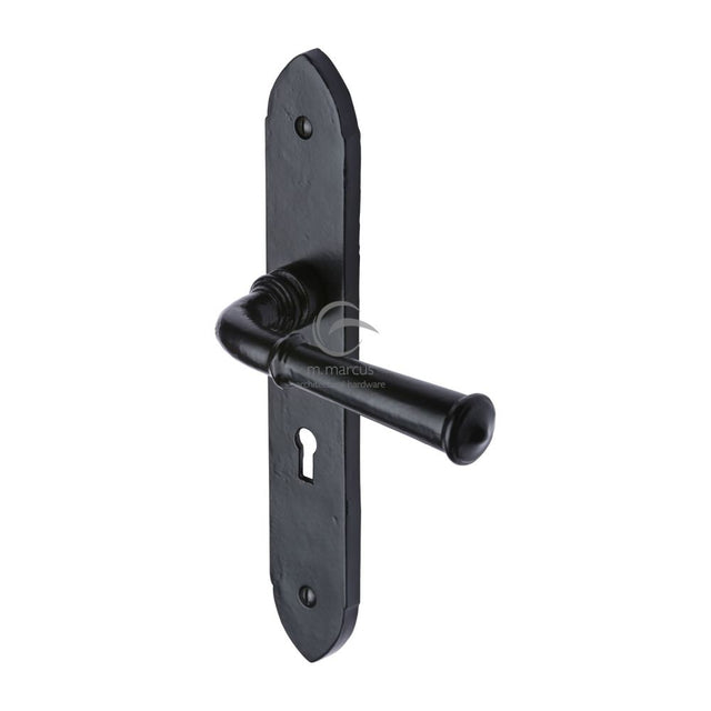 This is an image of a M.Marcus - Black Iron Rustic Door Handle Lever Lock Hadley Design, fb4700 that is available to order from T.H Wiggans Ironmongery in Kendal.