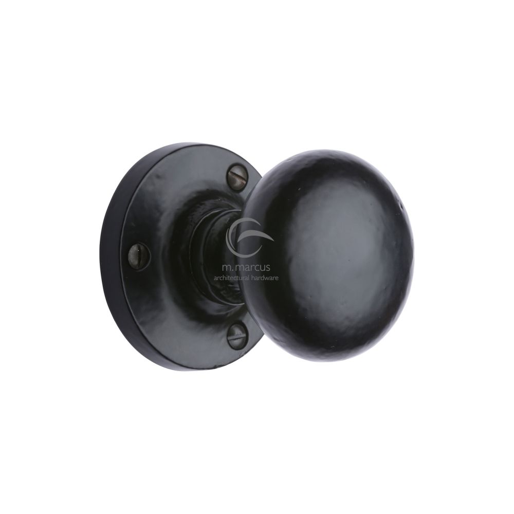 This is an image of a M.Marcus - Black Iron Rustic Mortice Knob on Rose Alveley Design, fb4975 that is available to order from T.H Wiggans Ironmongery in Kendal.