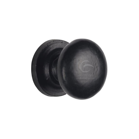 This is an image of a M.Marcus - Black Iron Rustic Cabinet Knob on Round Plate Round Design 25mm, fb613-25 that is available to order from T.H Wiggans Ironmongery in Kendal.
