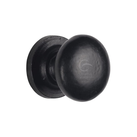 This is an image of a M.Marcus - Black Iron Rustic Cabinet Knob on Round Plate Round Design 32mm, fb613-32 that is available to order from T.H Wiggans Ironmongery in Kendal.