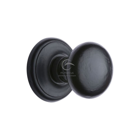 This is an image of a M.Marcus - Black Iron Rustic Round Centre Door Knob 3", fb901 that is available to order from T.H Wiggans Ironmongery in Kendal.