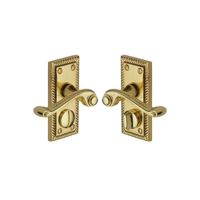 This is an image of a Heritage Brass - Door Handle for Privacy Set Georgian Short Design Polished Brass Fi, g055-pb that is available to order from T.H Wiggans Ironmongery in Kendal.