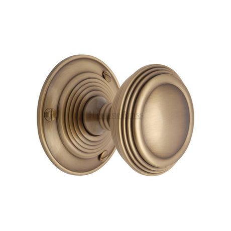 This is an image of a Heritage Brass - Mortice Knob on Rose Goodrich Design Antique Brass Finish, goo986-at that is available to order from T.H Wiggans Ironmongery in Kendal.