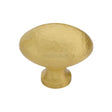 This is an image of a Heritage Brass - Cabinet Knob Victorian Oval Hammered Design 38mm Satin Brass finish, ham114-38-sb that is available to order from T.H Wiggans Ironmongery in Kendal.