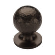 This is an image of a Heritage Brass - Cabinet Knob Ball Hammered Design 32mm Matt Bronze finish, ham8321-32-mb that is available to order from T.H Wiggans Ironmongery in Kendal.