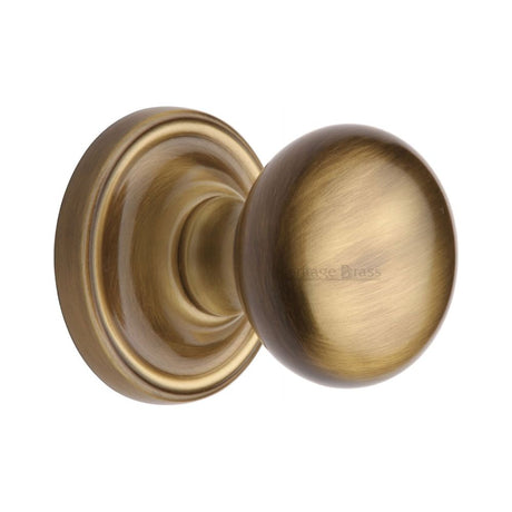 This is an image of a Heritage Brass - Mortice Knob on Rose Hampstead Design Antique Brass Finish, ham8361-at that is available to order from T.H Wiggans Ironmongery in Kendal.