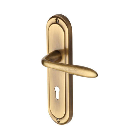 This is an image of a Heritage Brass - Door Handle Lever Lock Henley Design Antique Brass Finish, hen1200-at that is available to order from T.H Wiggans Ironmongery in Kendal.