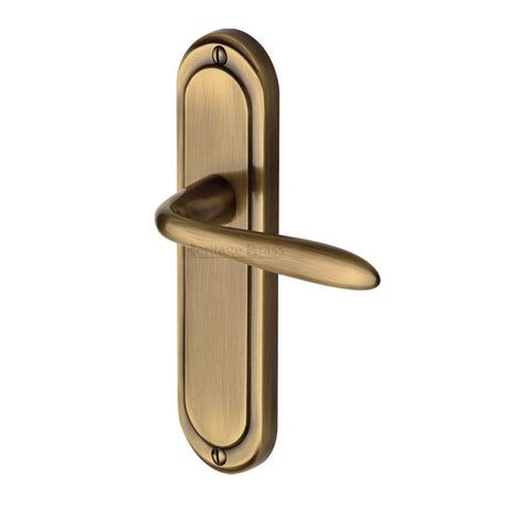 This is an image of a Heritage Brass - Door Handle Lever Latch Henley Design Antique Brass Finish, hen1210-at that is available to order from T.H Wiggans Ironmongery in Kendal.