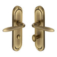 This is an image of a Heritage Brass - Door Handle for Bathroom Henley Design Antique Brass Finish, hen1230-at that is available to order from T.H Wiggans Ironmongery in Kendal.