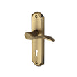 This is an image of a Heritage Brass - Door Handle Lever Lock Howard Design Antique Brass Finish, how1300-at that is available to order from T.H Wiggans Ironmongery in Kendal.