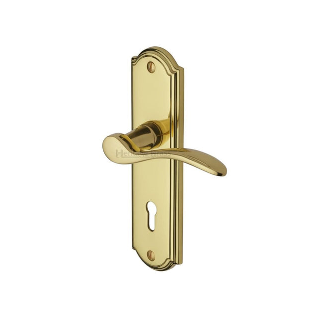 This is an image of a Heritage Brass - Door Handle Lever Lock Howard Design Polished Brass Finish, how1300-pb that is available to order from T.H Wiggans Ironmongery in Kendal.