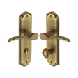 This is an image of a Heritage Brass - Door Handle for Bathroom Howard Design Antique Brass Finish, how1330-at that is available to order from T.H Wiggans Ironmongery in Kendal.