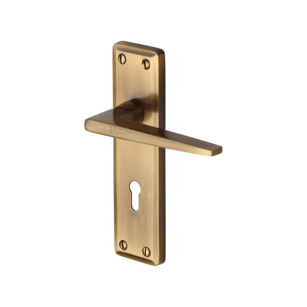This is an image of a Heritage Brass - Door Handle Lever Lock Kendal Design Antique Brass Finish, ken6800-at that is available to order from T.H Wiggans Ironmongery in Kendal.