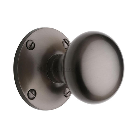 This is an image of a Heritage Brass - Mortice Knob on Rose Kensington Design Matt Bronze Finish, ken980-mb that is available to order from T.H Wiggans Ironmongery in Kendal.