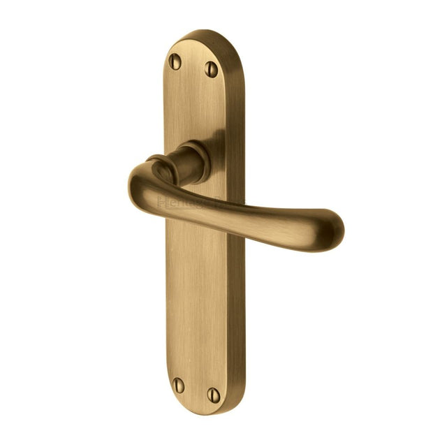 This is an image of a Heritage Brass - Door Handle Lever Latch Luna Design Antique Brass Finish, lun5310-at that is available to order from T.H Wiggans Ironmongery in Kendal.