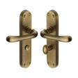 This is an image of a Heritage Brass - Door Handle for Bathroom Luna Design Antique Brass Finish, lun5330-at that is available to order from T.H Wiggans Ironmongery in Kendal.
