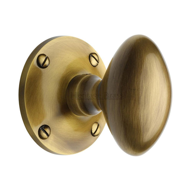 This is an image of a Heritage Brass - Mortice Knob on Rose Mayfair Design Antique Brass Finish, may960-at that is available to order from T.H Wiggans Ironmongery in Kendal.