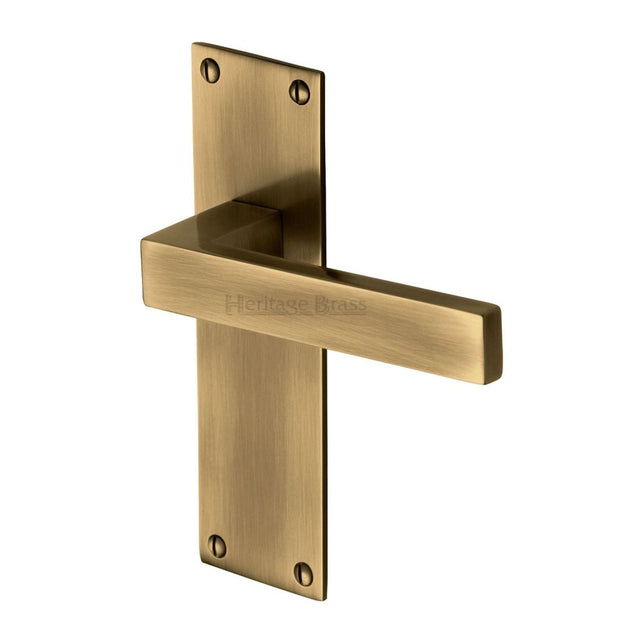 This is an image of a Heritage Brass - Door Handle Lever Latch Metro Design Antique Brass Finish, met4910-at that is available to order from T.H Wiggans Ironmongery in Kendal.