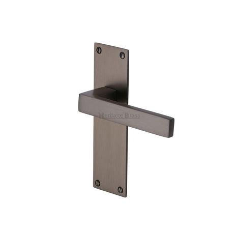 This is an image of a Heritage Brass - Door Handle Lever Latch Metro Design Matt Bronze Finish, met4910-mb that is available to order from T.H Wiggans Ironmongery in Kendal.