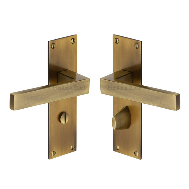 This is an image of a Heritage Brass - Door Handle for Bathroom Metro Design Antique Brass Finish, met4930-at that is available to order from T.H Wiggans Ironmongery in Kendal.