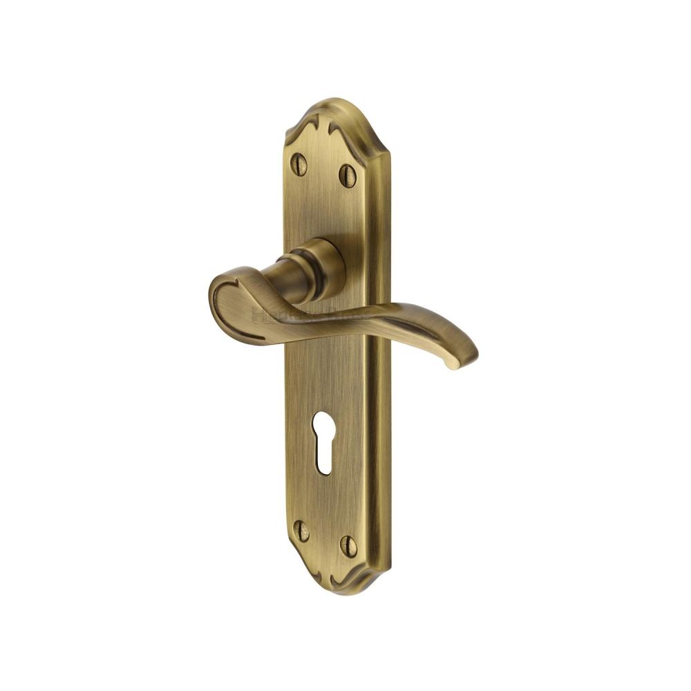 This is an image of a Heritage Brass - Door Handle Lever Lock Verona Small Design Antique Brass Finish, mm624-at that is available to order from T.H Wiggans Ironmongery in Kendal.