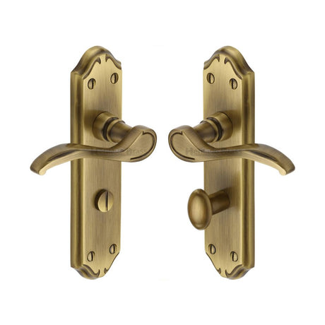 This is an image of a Heritage Brass - Door Handle for Bathroom Verona Small Design Antique Brass Finish, mm628-at that is available to order from T.H Wiggans Ironmongery in Kendal.