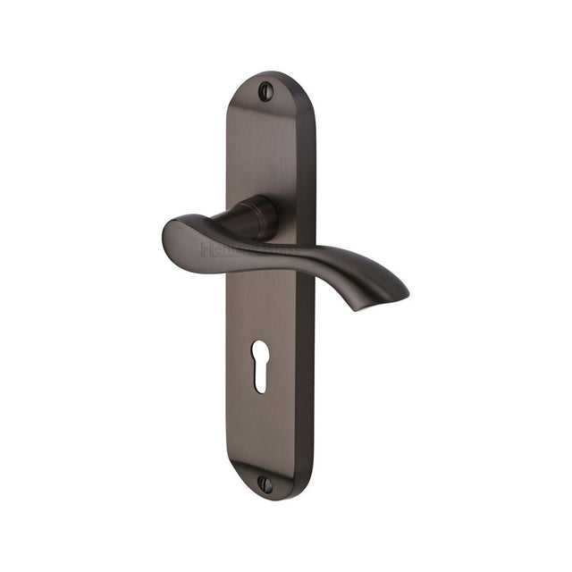 This is an image of a Heritage Brass - Door Handle Lever Lock Algarve Design Matt Bronze Finish, mm924-mb that is available to order from T.H Wiggans Ironmongery in Kendal.
