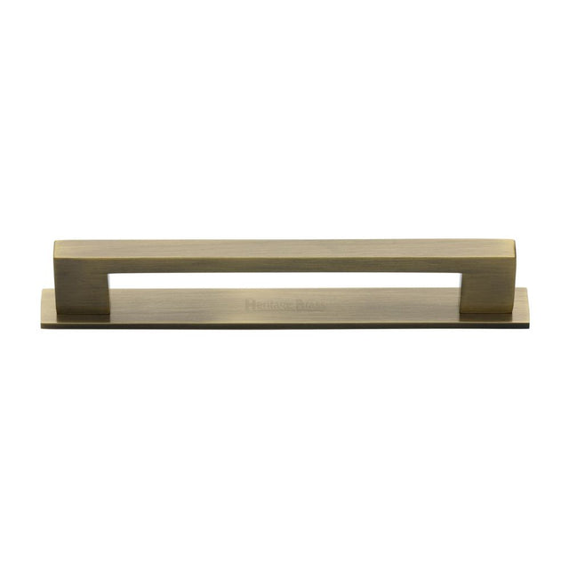 This is an image of a Heritage Brass - Cabinet Pull Metro Design with Plate 160mm CTC Antique Brass Finis, pl0337-160-at that is available to order from T.H Wiggans Ironmongery in Kendal.