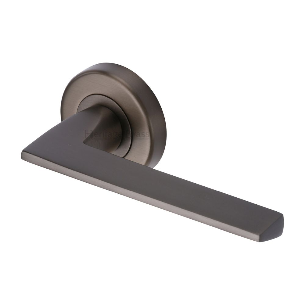This is an image of a Heritage Brass - Door Handle Lever Latch on Round Rose Pyramid Design Matt Bronz, pyd3535-mb that is available to order from T.H Wiggans Ironmongery in Kendal.