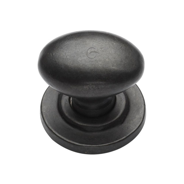 This is an image of a M.Marcus - Rustic Dark Bronze Cabinet Knob Oval Design on Rose 32mm, rdb179-32 that is available to order from T.H Wiggans Ironmongery in Kendal.