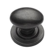 This is an image of a M.Marcus - Rustic Dark Bronze Cabinet Knob Oval Design on Rose 38mm, rdb179-38 that is available to order from T.H Wiggans Ironmongery in Kendal.